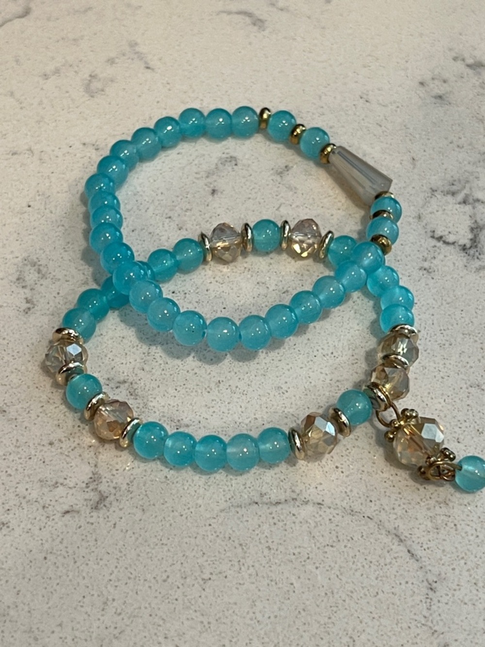 Set of 2 Blue gold tone stretchy bracelets